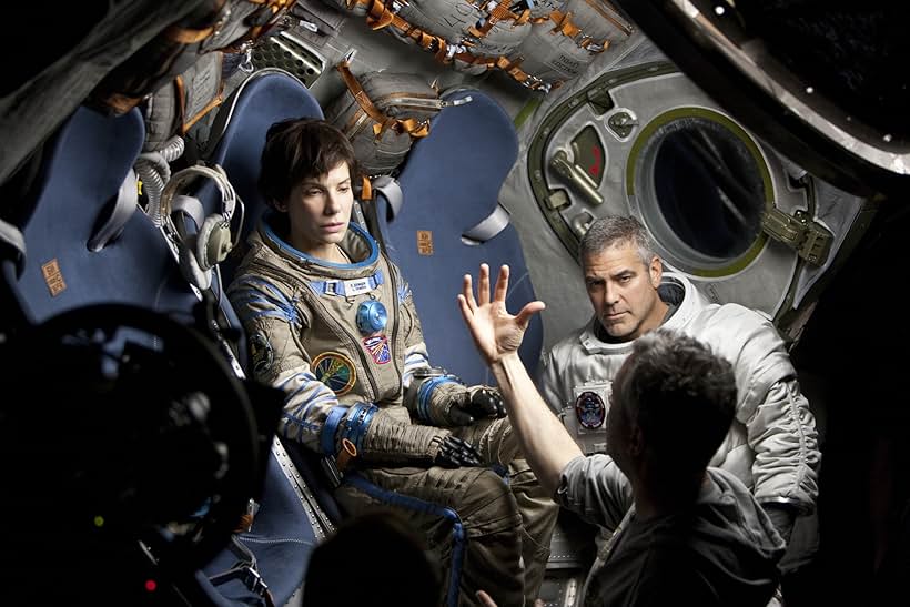 Sandra Bullock, George Clooney, and Alfonso Cuarón in Gravity (2013)