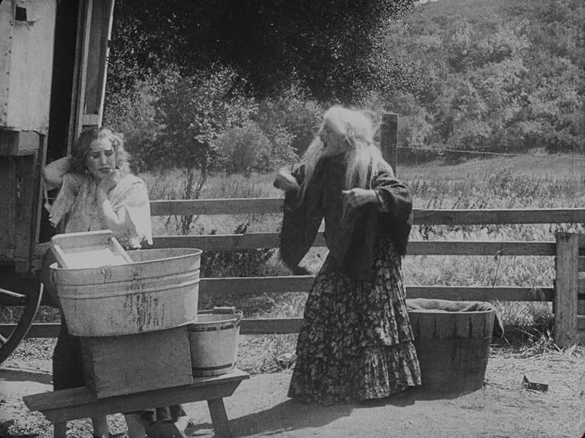 Edna Purviance and Leo White in The Vagabond (1916)