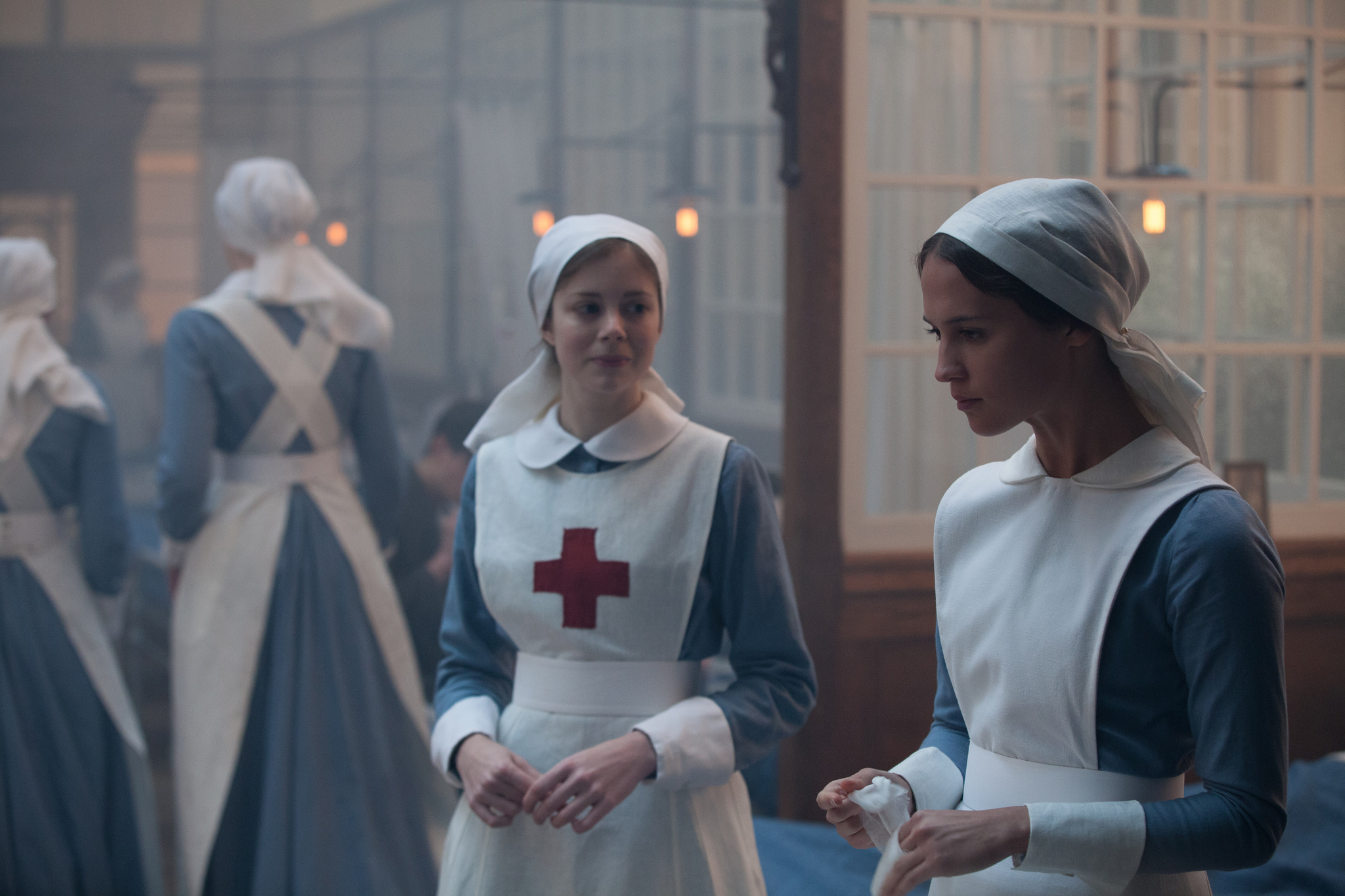 Alicia Vikander and Charlotte Hope in Testament of Youth (2014)