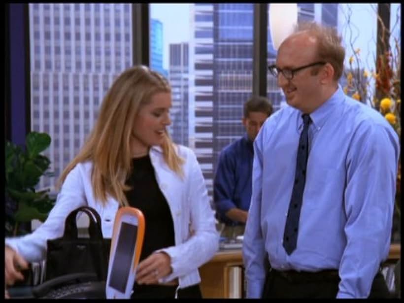 Rebecca Romijn and Brian Posehn in Just Shoot Me! (1997)