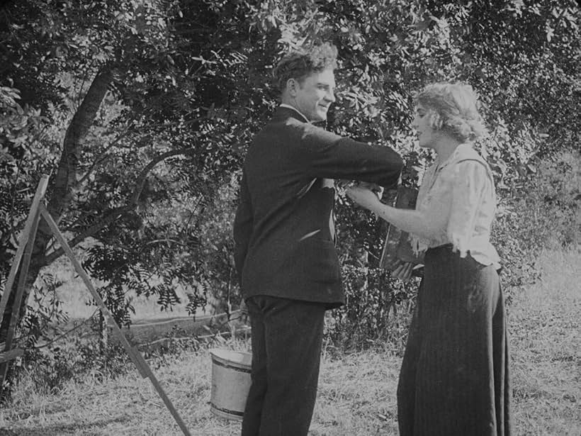 Lloyd Bacon and Edna Purviance in The Vagabond (1916)