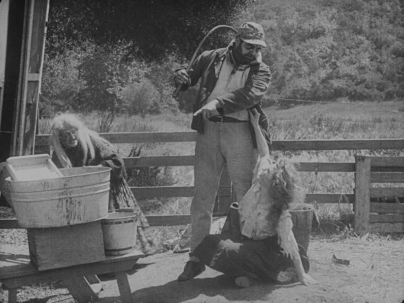 Eric Campbell, Edna Purviance, and Leo White in The Vagabond (1916)