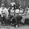 Charles Chaplin, Albert Austin, Eric Campbell, James T. Kelley, John Rand, and Leo White in Behind the Screen (1916)