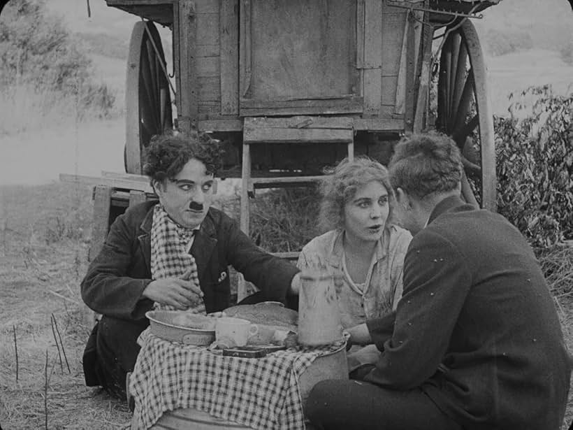 Charles Chaplin, Lloyd Bacon, and Edna Purviance in The Vagabond (1916)