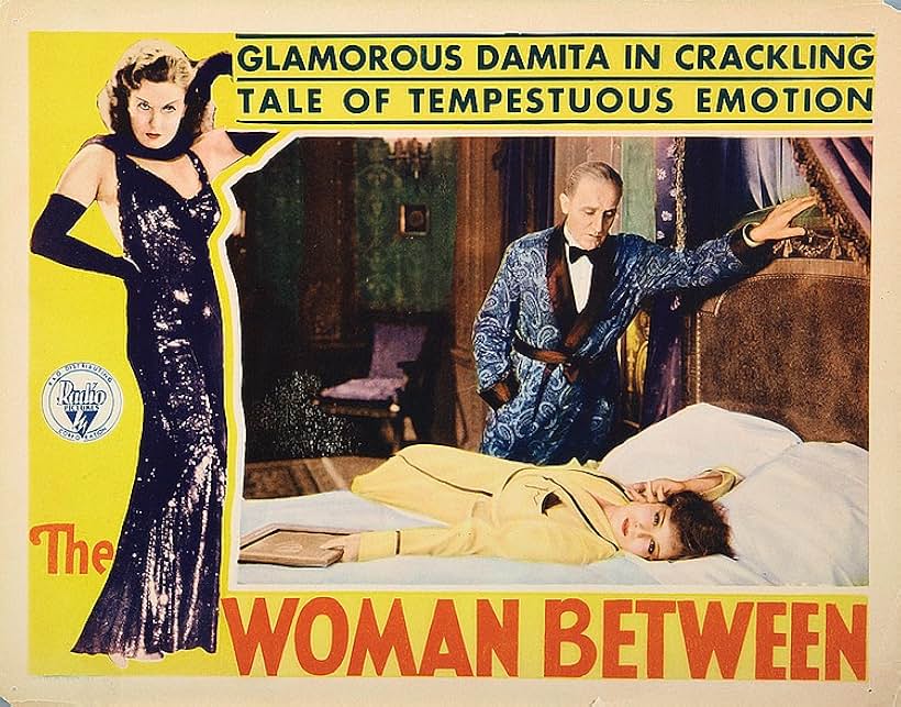 Lili Damita and O.P. Heggie in The Woman Between (1931)