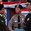 George Gaynes, Lance Kinsey, and Art Metrano in Police Academy 3: Back in Training (1986)