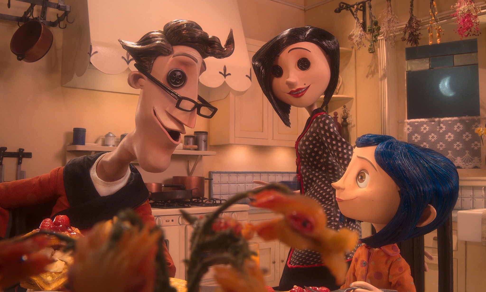 Teri Hatcher, Dakota Fanning, and John Hodgman in Coraline (2009)