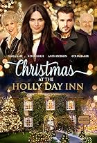 Colin Baker, Anita Dobson, Kevin Leslie, and Tamla Kari in Christmas at the Holly Day Inn (2023)