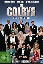 Charlton Heston, Stephanie Beacham, Maxwell Caulfield, Ricardo Montalban, Katharine Ross, Tracy Scoggins, Barbara Stanwyck, Ken Howard, John James, Emma Samms, and Claire Yarlett in The Colbys (1985)