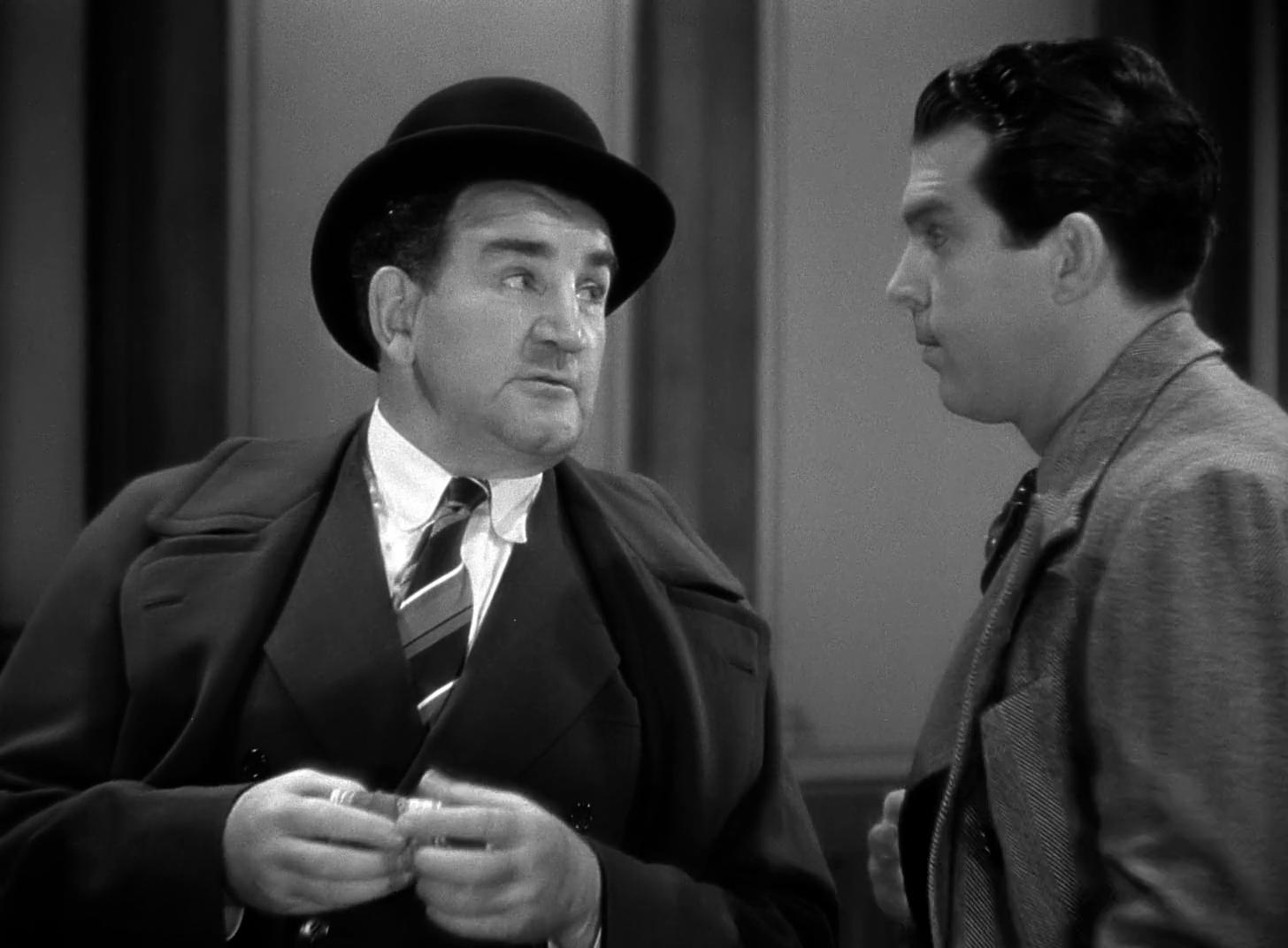 Tom Kennedy and Fred MacMurray in Remember the Night (1939)