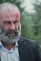 Turgut Tunçalp in Escape (2013)