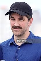 CANNES, FRANCE - MAY 19: Evan Johnson attends the "Rumours" Photocall at the 77th annual Cannes Film Festival at Palais des Festivals on May 19, 2024 in Cannes, France. (Photo by Andreas Rentz/Getty Images)