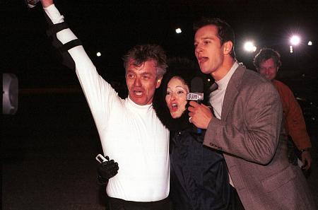 "I Dare You" TV show (Nash Entertainment/UPN) host Tyler Harcott, Stephen R. Hudis, and wife Lindy S. Hudis celebrating after learning that Stephen set a new world record after his bus-jump in January, 2000 at Las Vegas Speedway, Las Vegas, NV.