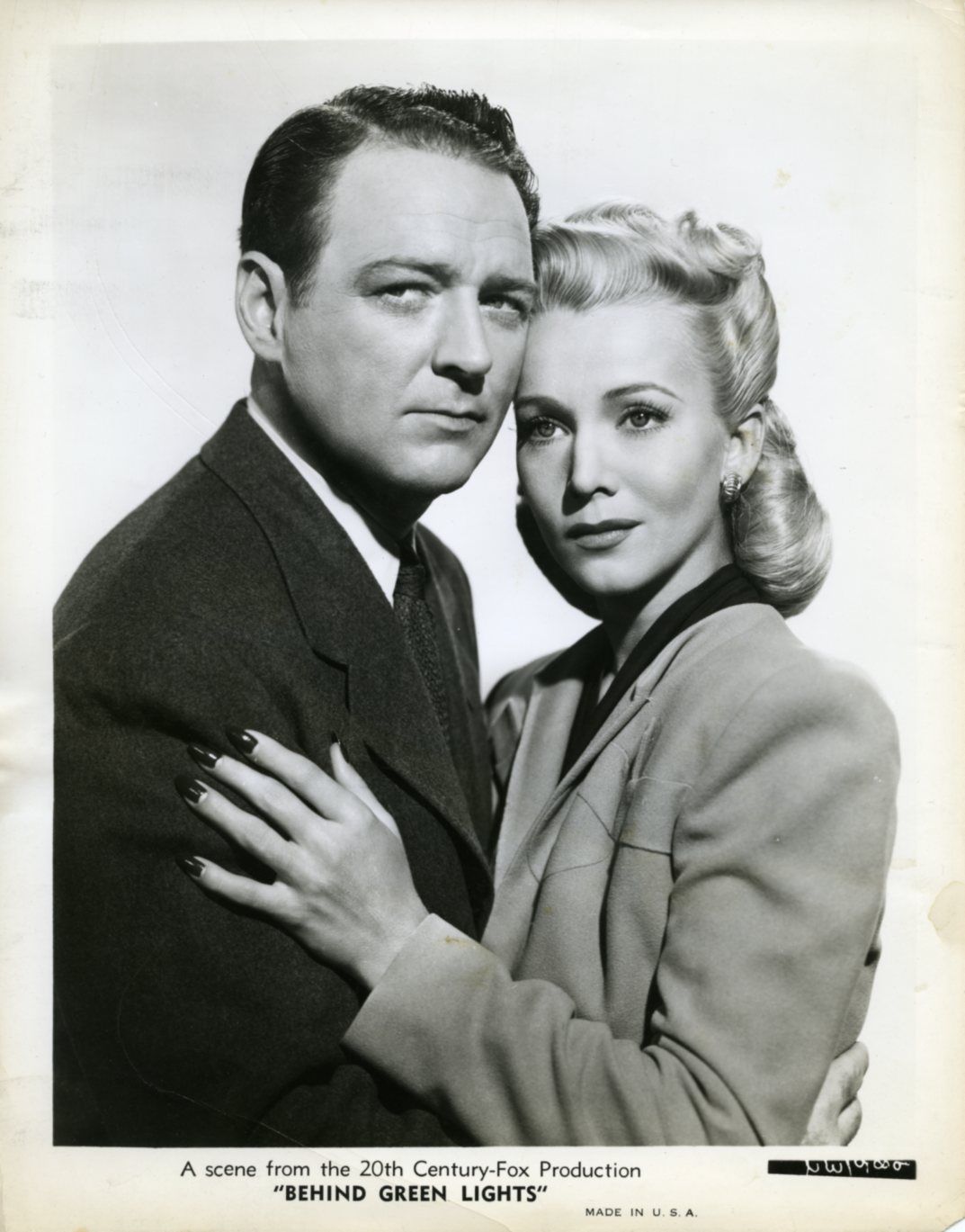 William Gargan and Carole Landis in Behind Green Lights (1946)