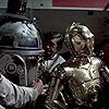 Anthony Daniels, Mark Hamill, and Kenny Baker in Star Wars (1977)