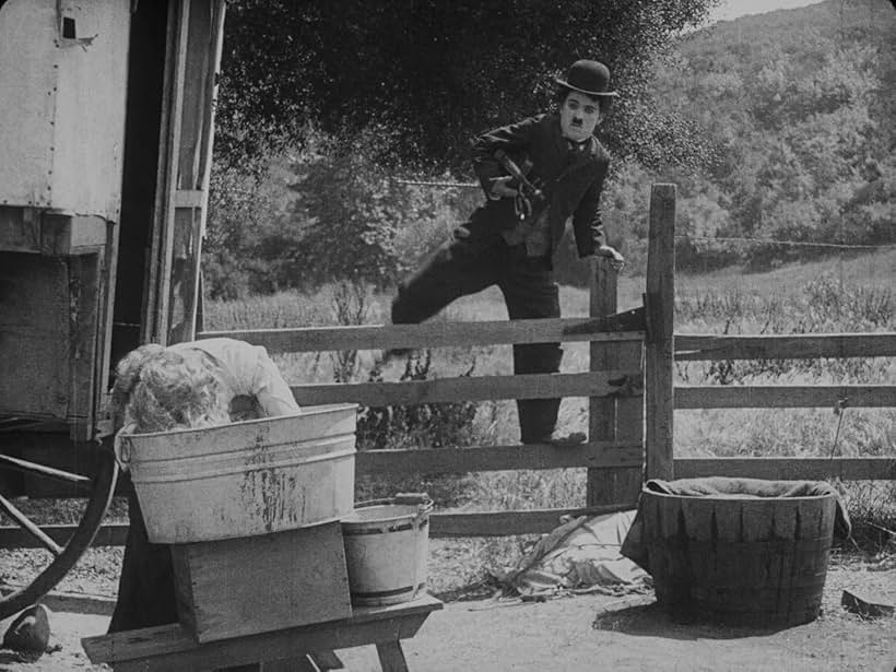 Charles Chaplin and Edna Purviance in The Vagabond (1916)