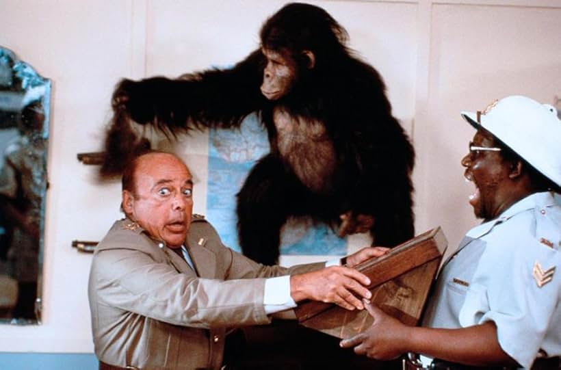 Herbert Lom and Deep Roy in Going Bananas (1987)