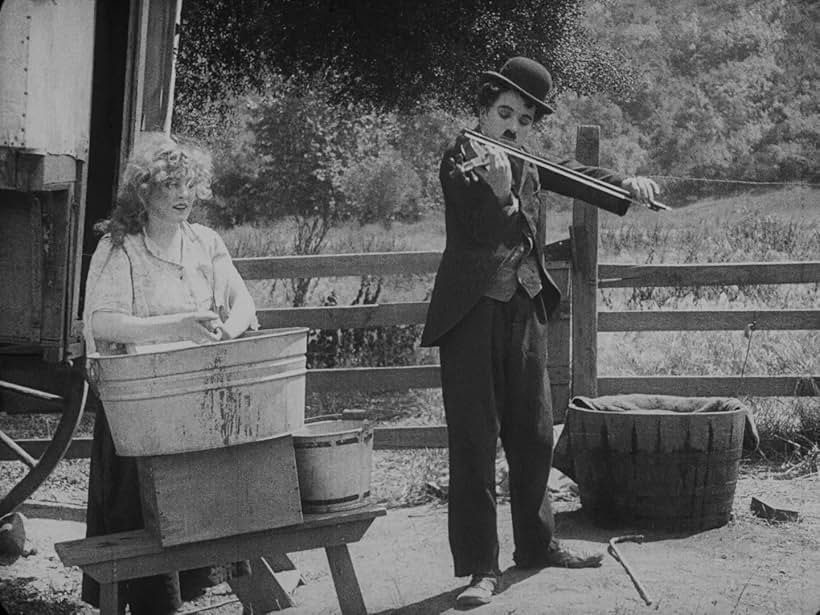 Charles Chaplin and Edna Purviance in The Vagabond (1916)