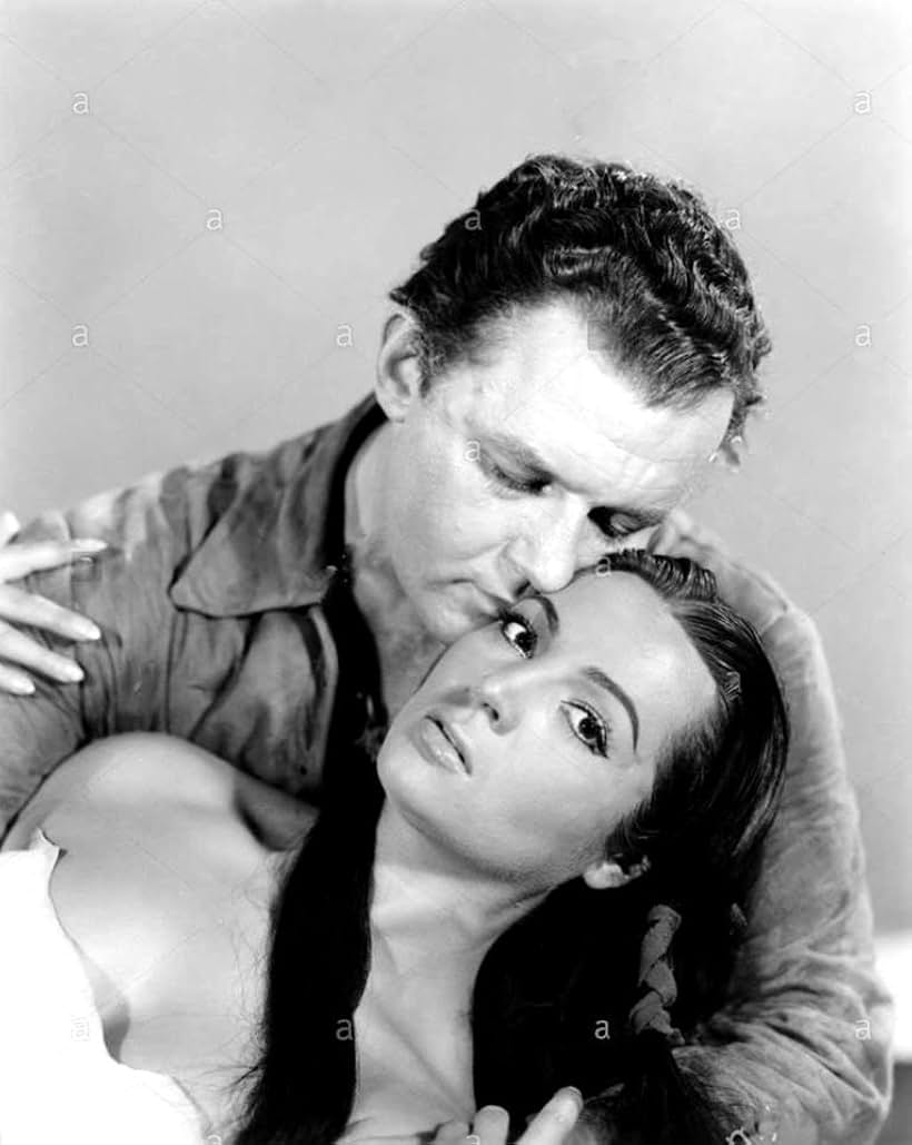 Rod Steiger and Sara Montiel in Run of the Arrow (1957)