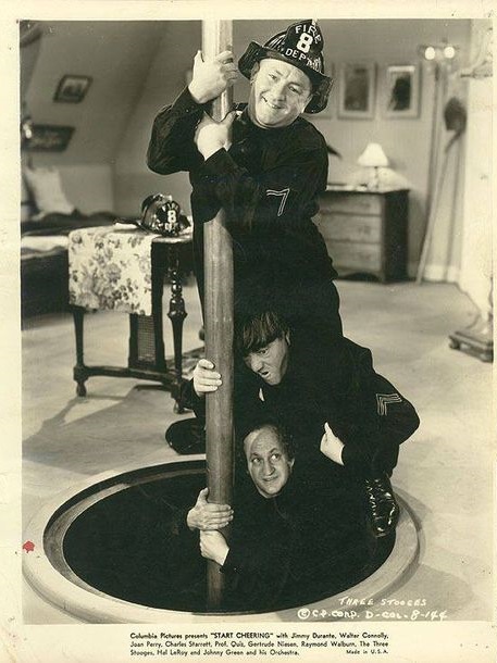 Moe Howard, Larry Fine, Curly Howard, and The Three Stooges in Start Cheering (1938)