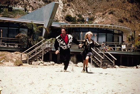 Andrew Dice Clay and Maddie Corman in The Adventures of Ford Fairlane (1990)