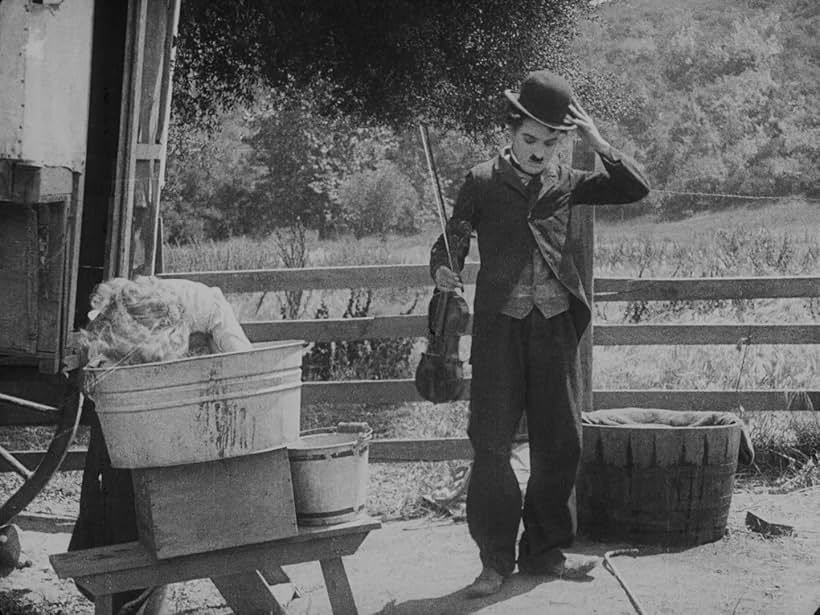 Charles Chaplin and Edna Purviance in The Vagabond (1916)