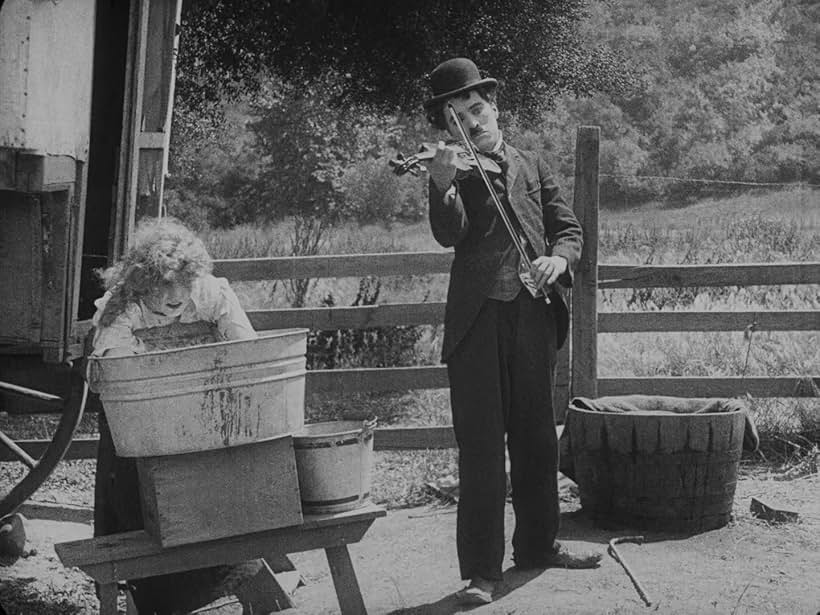 Charles Chaplin and Edna Purviance in The Vagabond (1916)