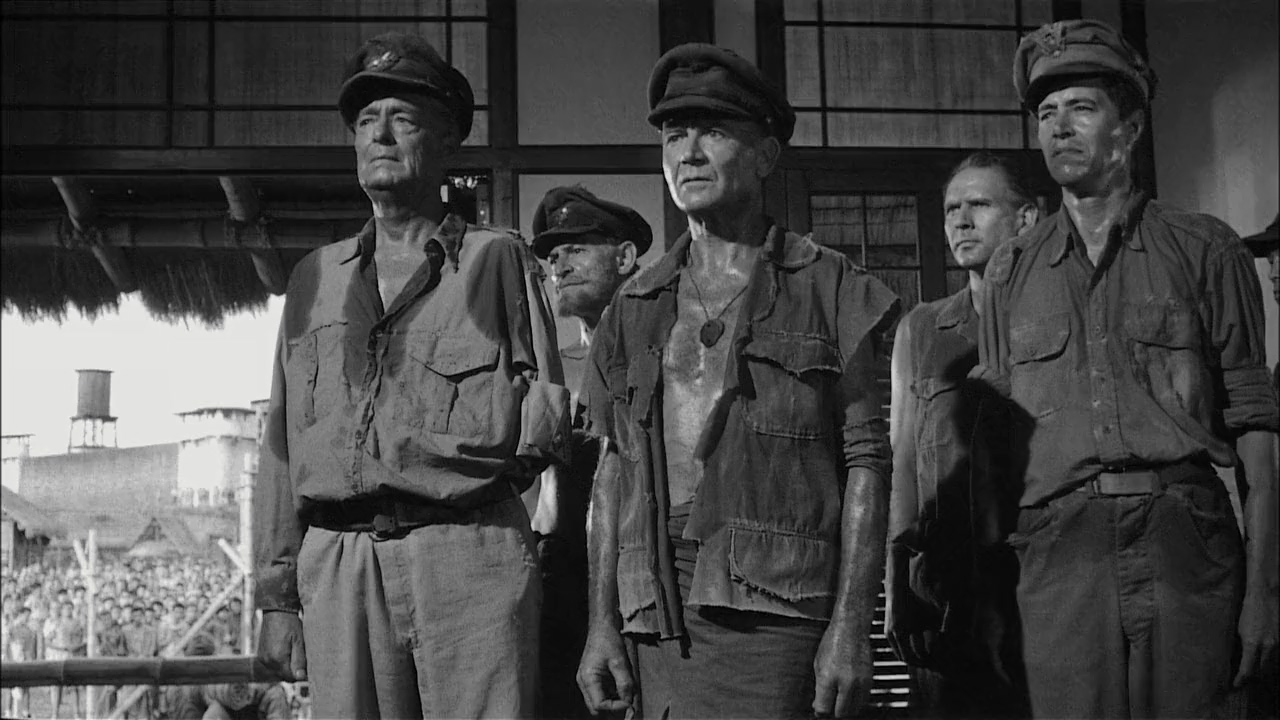 Wright King, John Mills, Gerald Sim, John Warburton, and Alan Webb in King Rat (1965)