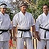 Ralph Macchio, Yuji Okumoto, and William Zabka in Underdogs (2024)