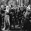 Olivia de Havilland, Errol Flynn, Alan Hale, Ian Hunter, Patric Knowles, Herbert Mundin, and Eugene Pallette in The Adventures of Robin Hood (1938)