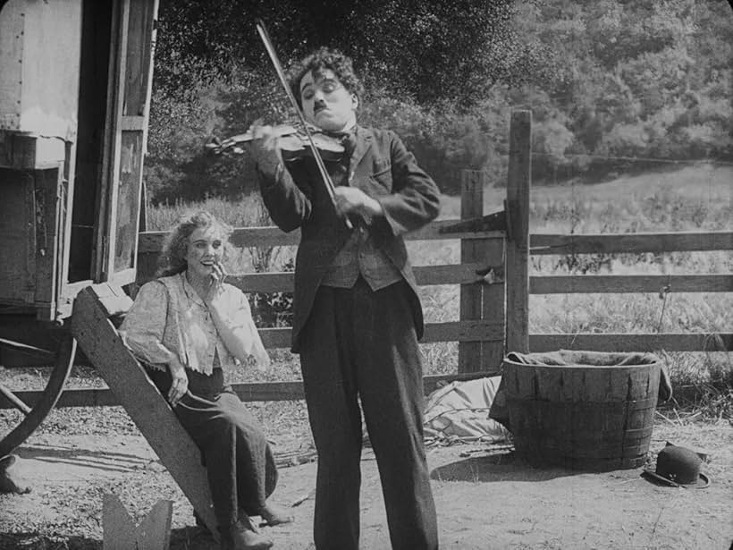 Charles Chaplin and Edna Purviance in The Vagabond (1916)