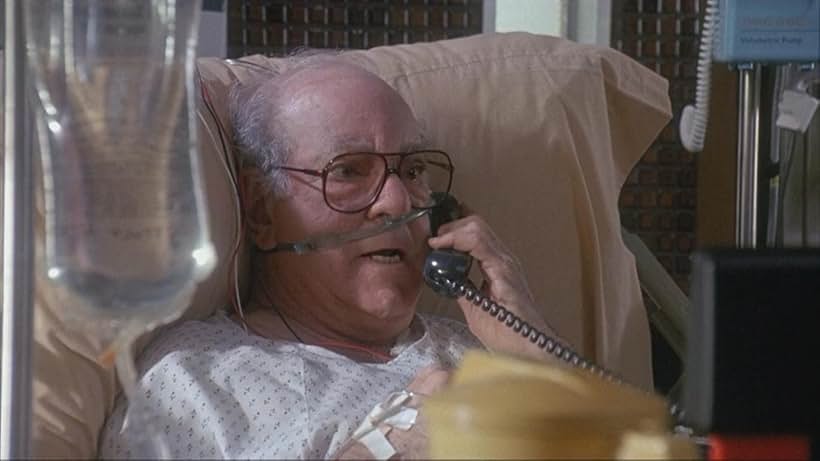 Stephen Elliott in Taking Care of Business (1990)