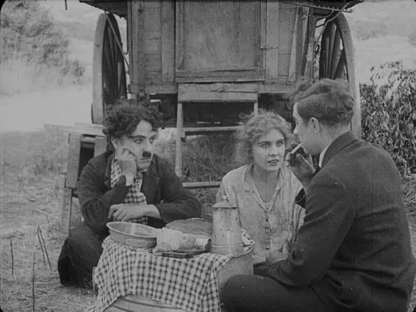 Charles Chaplin, Lloyd Bacon, and Edna Purviance in The Vagabond (1916)