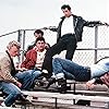 John Travolta, Jeff Conaway, Barry Pearl, Michael Tucci, and Kelly Ward in Grease (1978)