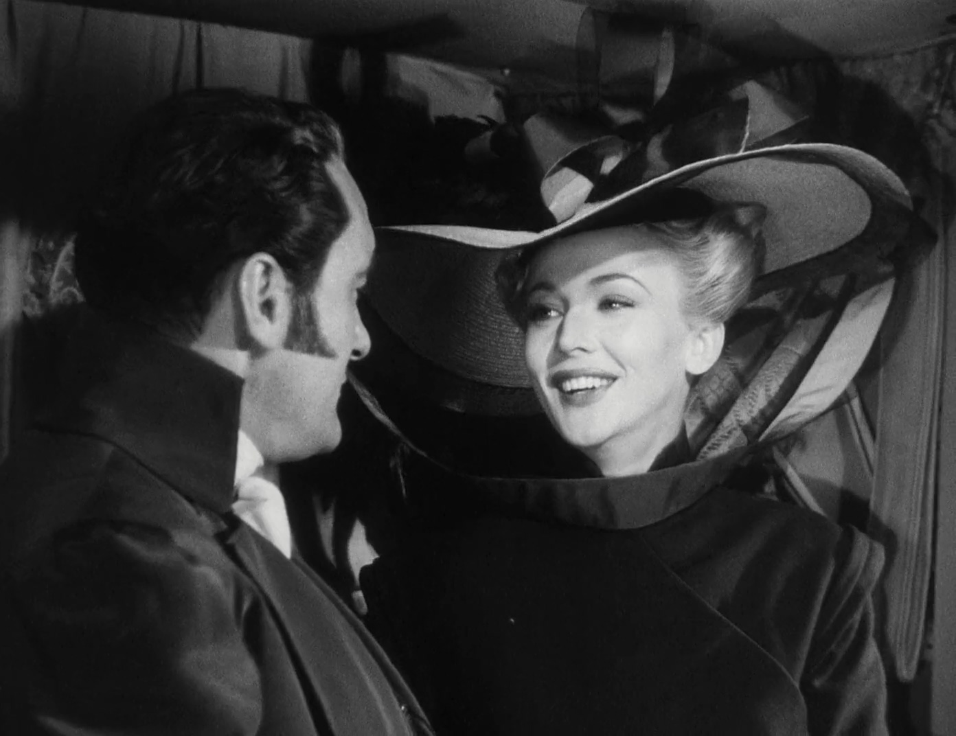 George Sanders and Carole Landis in A Scandal in Paris (1946)