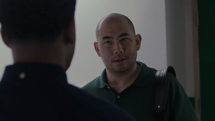 Walter Anaruk as Coach Doug Nguyen in the Netflix film Amateur. Written and directed by Ryan Koo.