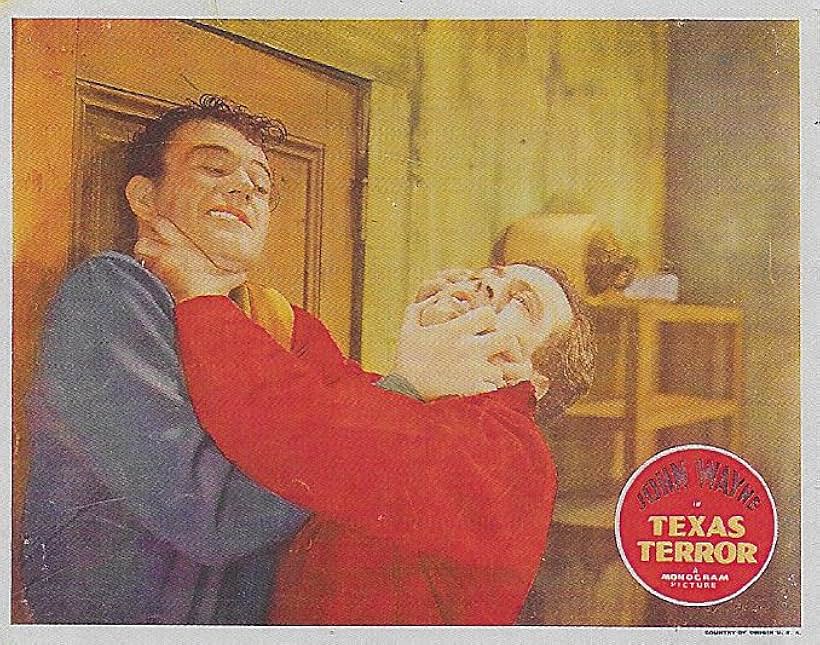 John Wayne and LeRoy Mason in Texas Terror (1935)