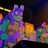 Brandon Mychal Smith and Josh Brener in Rise of the Teenage Mutant Ninja Turtles (2018)