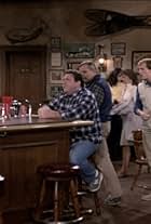 Woody Harrelson, John Ratzenberger, and George Wendt in Cheers (1982)