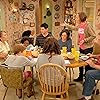 John Goodman, Roseanne Barr, Sara Gilbert, Michael Fishman, Laurie Metcalf, Emma Kenney, Jayden Rey, and Ames McNamara in Roseanne (1988)