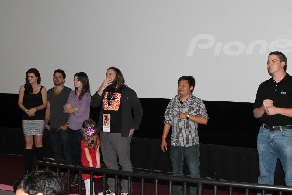 Thom Stark (center) answers questions after the screening of his film, Revolution.