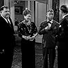 Oliver Hardy, Esther Howard, Stan Laurel, and Arthur Space in The Big Noise (1944)