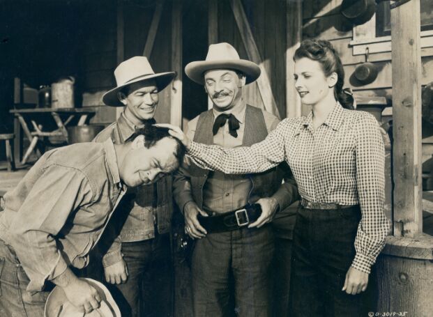 Spade Cooley, Carole Mathews, Dub Taylor, and Philip Van Zandt in Outlaws of the Rockies (1945)