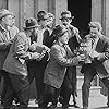 Albert Austin, James T. Kelley, John Rand, and Leo White in Behind the Screen (1916)