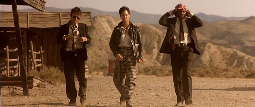 Sy Richardson, Dick Rude, and Joe Strummer in Straight to Hell (1987)