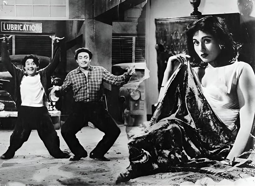 Anoop Kumar, Kishore Kumar, and Madhubala in Chalti Ka Naam Gaadi (1958)