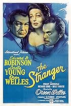 Edward G. Robinson, Orson Welles, and Loretta Young in The Stranger (1946)