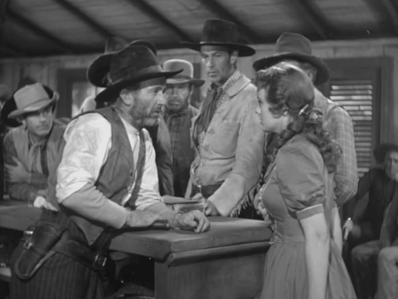 Gary Cooper, Walter Brennan, and Doris Davenport in The Westerner (1940)