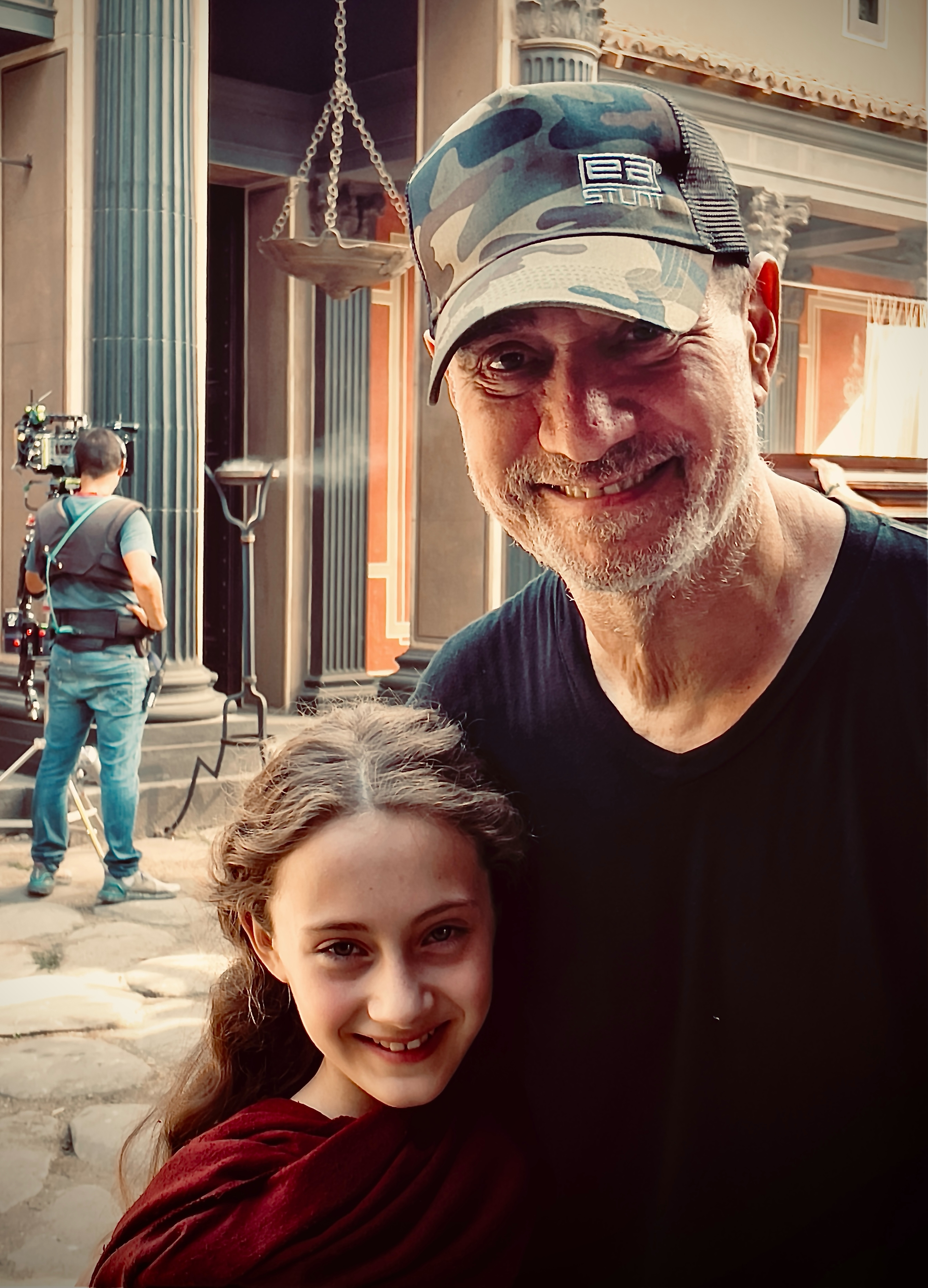 Mia McGovern Zaini and Roland Emmerich on the set of °Those About to Die."