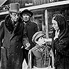 Agnes Moorehead, George Coulouris, Harry Shannon, and Buddy Swan in Citizen Kane (1941)